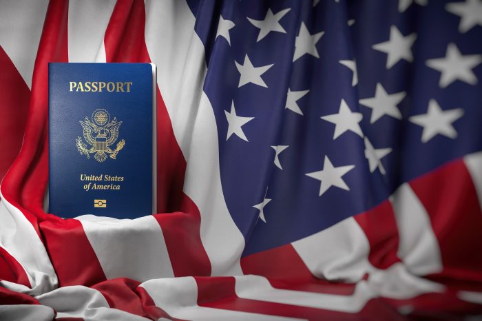 usa-passport-on-the-flag-of-the-us-united-stetes-getting-a-usa-700x466 