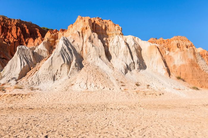 red-cliffs-at-falesia-beach-PXWFZLV-o070g2wgiiqsbf8yehgea93ak6ax10pgile9ismi44 